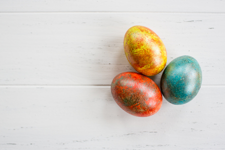 Easter eggs on white wooden backgroundの写真素材