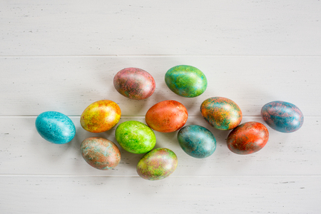 Easter eggs on white wooden backgroundの写真素材