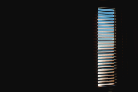 Wood blinds or curtain and sun light in behindの写真素材