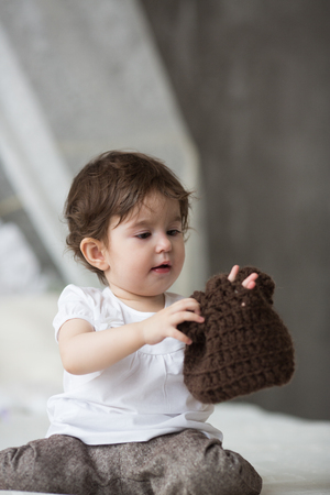 Happy little girl with brown hatの写真素材