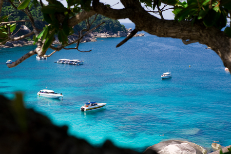 Beautiful sea landscape with tropical coast and the high-speed boat at Tachai island, Phang nga, Thailandの写真素材