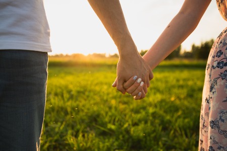 A couple holding hands. Closeupの写真素材