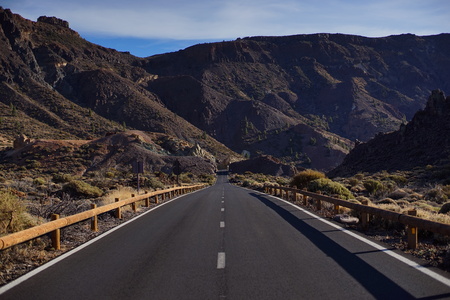 road going into the distance a mountainous landscapeの写真素材