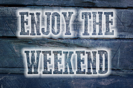 Enjoy The Weekend Concept text on backgroundの写真素材
