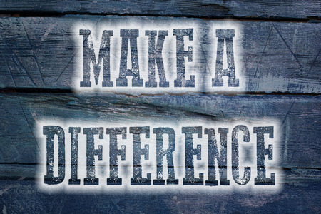 Make A Difference Concept text on backgroundの写真素材