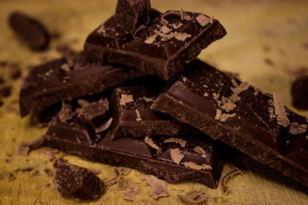 CHOCOLATE BARS ON WOODEN TABLEの写真素材