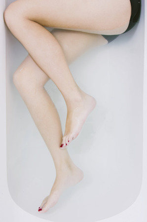 Female legs in in the bathtub, part of the bodyの写真素材