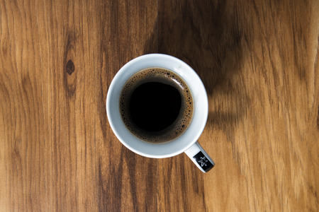 Coffee cup on the old wooden tableの写真素材