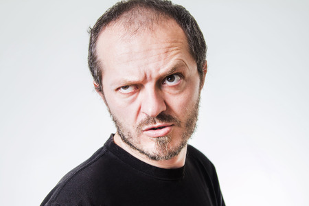 Aggressive man with beard and mustaches, threateningの写真素材