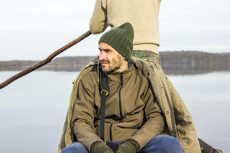 Men in boat on the river, rowing, adventure, realの写真素材