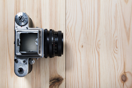 Old analog medium format camera on the desk