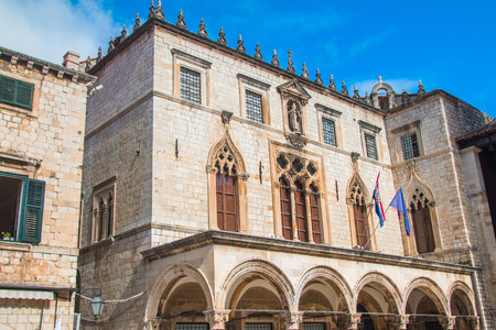 Sponza Palace in Dubrovnik with flag of Croatia and European Union. Sponza Palace was built in 16th century.のeditorial素材