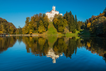 Castle of Trakoscan on the hill in autumn, Zagorje, Croatia, reflection on the lakeのeditorial素材