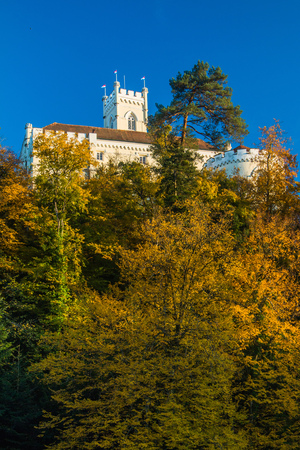 Roof of the Castle of Trakoscan above trees on hill in autumn, Zagorje, Croatiaのeditorial素材