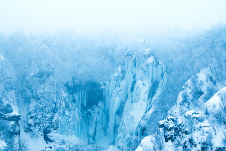 Frozen waterfalls in mist in nature park Plitvice, Croatiaの写真素材