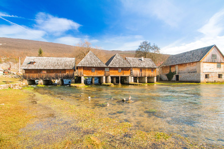 Old wooden water mills in on Majerovo vrilo, source of Gacka river, Lika, Croatiaの写真素材