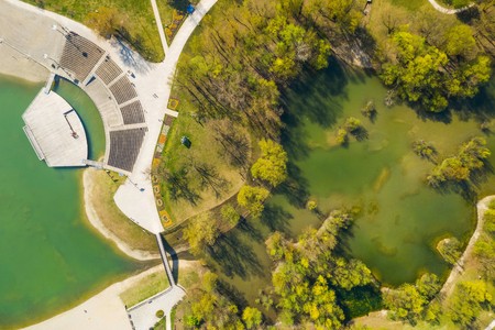Croatia, Zagreb city, Bundek lake from drone, overhead view, green recreaction park and summer music stageの写真素材