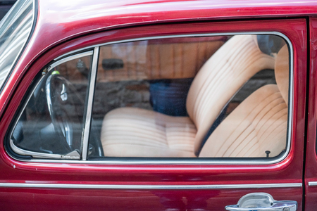Old red beetle car shot in Zagreb, Croatia, rusty old timer in front of the building wallのeditorial素材