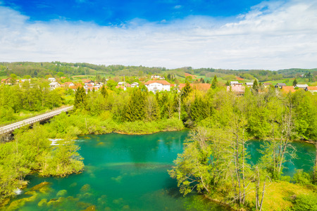 Croatia, green countryside, Mreznica river from air, panoramic view of Belavici village, waterfalls in spring, popular tourist camping resort destinationの写真素材