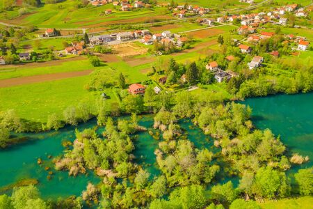 Croatia, landscape of Mreznica river from air, panoramic view of Belavici village, waterfalls in spring, popular camping tourist destinationの写真素材