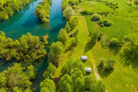 Camping on river - Croatian countryside landscape, beautiful green Mreznica river from air, panoramic view in spring, popular tourist destinationの写真素材