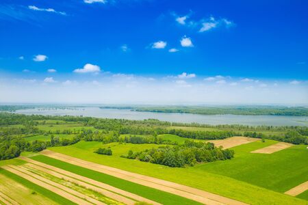 Beautiful countryside landscape in nature park Lonjsko polje, Croatia, from air, panoramic view, agriculture fields and flooded field in springの写真素材