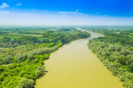 Sava river fron air, landscape in nature park Lonjsko polje, Croatia, panoramic view of woods and river floodsの写真素材