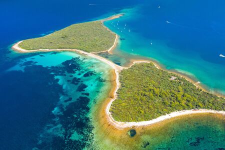 Beautiful exotic bra shaped islands in turquoise sea, clear blue water on the island of Dugi Otok in...
