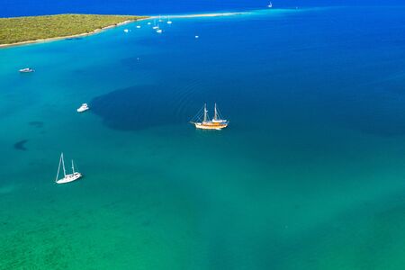 Croatia, Adriatic sea, aerial view of sailing boats and yachts in beautiful turquoise lagoon on Dugi Otok island, beautiful seascapeの写真素材