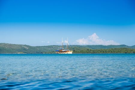 Beutiful old boat anchored on the island of Dugi Otok in Croatia, Adriatic sea archipelagoの写真素材