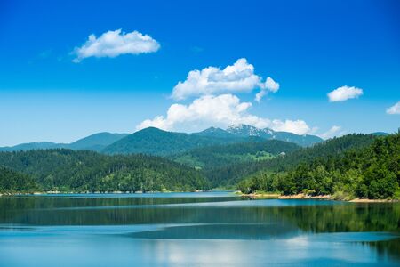 Croatia, beautiful lake in Gorski kotar, Lokve, Risnjak mountain in background, reflection in watterの写真素材