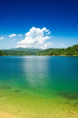Croatia, beautiful lake in Gorski kotar, Lokve, Risnjak mountain in background, reflection in watterの写真素材