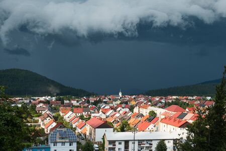 Summer storm clouds over the town of Delnice in Gorski kotar, Croatia, panoramaの写真素材