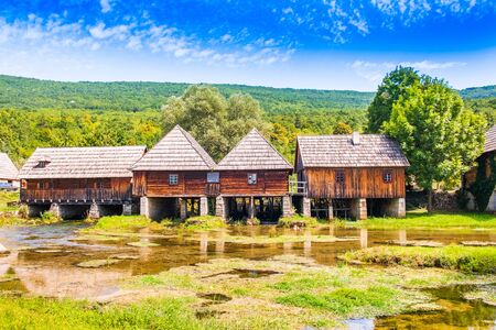 Croatia, region of Lika, Majerovo vrilo river source of Gacka, traditional village, old wooden mills and cottagesの写真素材