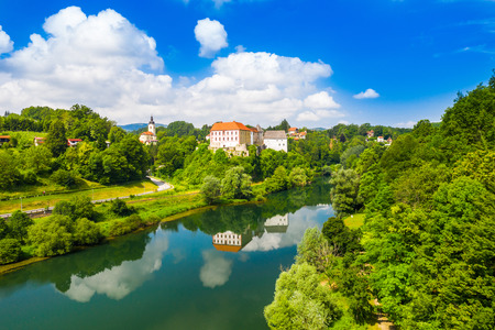 Aerial drone view of the river Kupa and Ozalj Castle in the town of Ozalj, Croatiaのeditorial素材