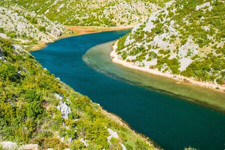 Deep canyon of beautiful green Zrmanja river in Croatiaの写真素材