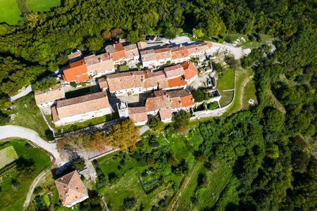 Old town of Hum on the hill, beautiful traditional architecture in Istria, Croatia, aerial view from droneの写真素材