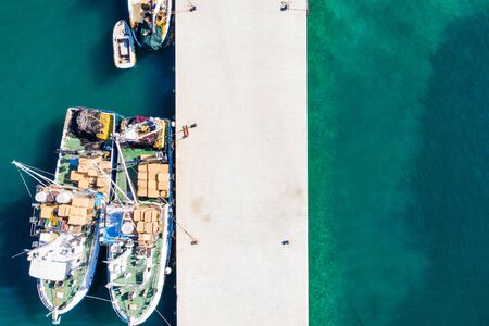 Aerial overhead view of fishing ships in town of Biograd na Moru, Croatiaの写真素材