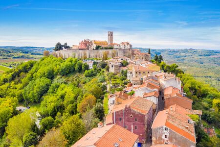 Old town of Motovun on the hill, beautiful architecture in Istria, Croatia, aerial view from droneの写真素材