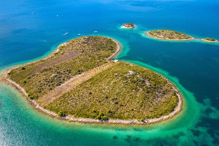 Croatia, beautiful coastline on Adriatic sea, romantic heart shaped island of Galesnjak, aerial drone viewの写真素材