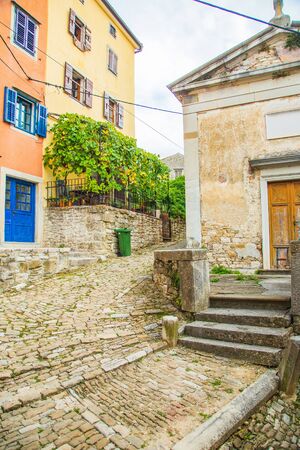 Croatia, Istria, beautiful old cobbled street, traditional houses and in the old historical town of Motovunの写真素材