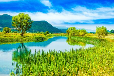 Croatia, beautiful scenic landscape, Gacka river among grass banks in Lika regionの写真素材
