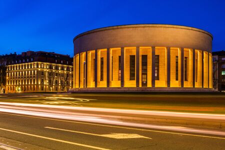 Croatia, city of Zagreb in the night, car light on the street and monumental column architecture in background, long exposure, city vibeの写真素材
