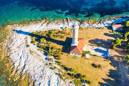 Croatia, beautiful Adriatic coastline, aerial view of the old lighthouse of Veli Rat on the island of Dugi Otok, sea shore in early morningの写真素材