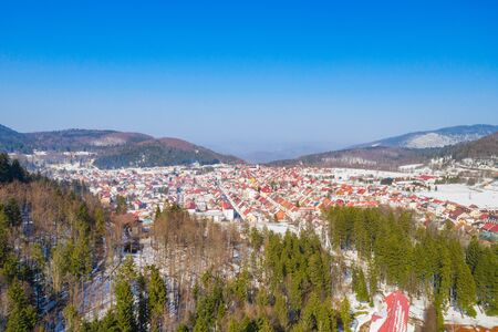Croatia, town of Delnice in Gorski kotar, panoramic view of town center from drone in winter, mountain landscape in backgroundの写真素材