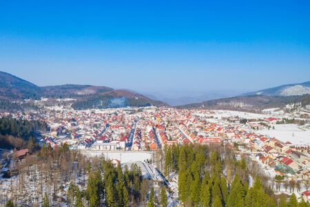 Croatia, town of Delnice in Gorski kotar, panoramic view of town center from drone in winter, mountain landscape in backgroundの写真素材