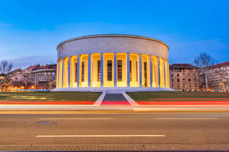 Croatia, city of Zagreb in the night, car on the street and monumental column architecture in background, long exposure, city vibeのeditorial素材