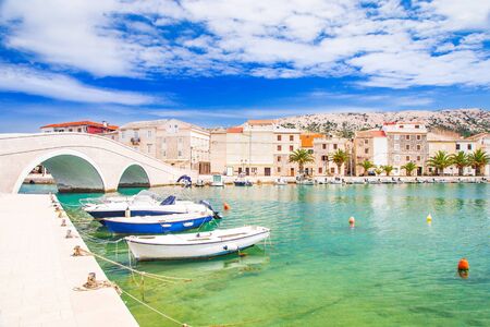 Beautiful town of Pag, old stone bridge and marina in Dalmatia, Croatiaの写真素材