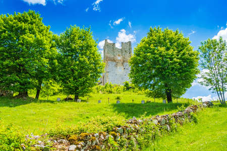 Croatia, region of Lika, beautiful green countryside landscape and Brinje castle ruinsのeditorial素材
