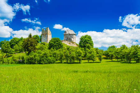 Croatia, region of Lika, beautiful green countryside landscape and Brinje castle ruinsのeditorial素材